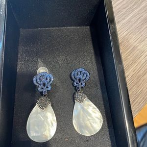 Beautiful evening earrings, mother of pearl and dark blue crystal design.